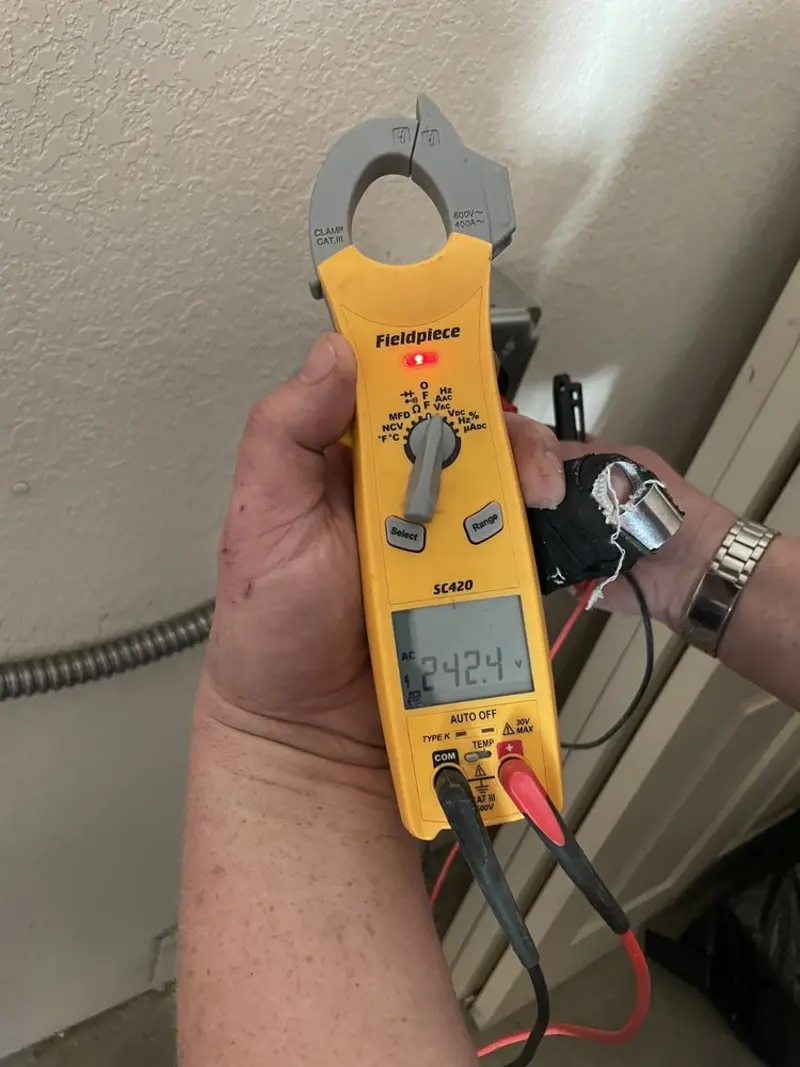 Voltage testing with clamp meter during Aluminum Wiring Replacement in Hilton